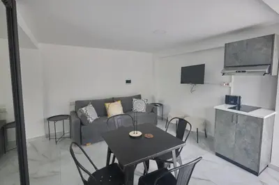 a living room with a table and a couch at Gold Emerging Villas Ltd Apart 1 in Ayia Napa