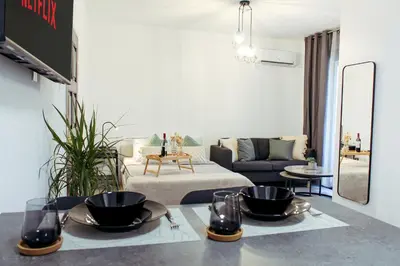 a living room with a table with two bowls on it at Cozy Studio Apt - Tourist Area Collection in Limassol