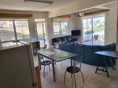 a living room with a table and a couch at Lovely house apartment 2 bedrooms wiht nice view in Voroklini
