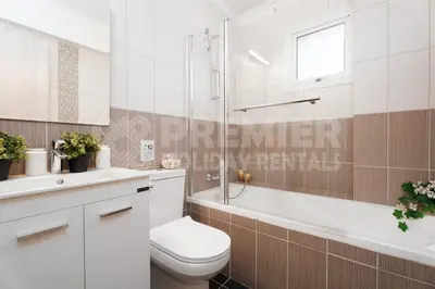 a bathroom with a toilet and a shower and a sink at Apartment Anabelle in Paralimni