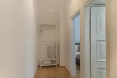 a room with a bed and a door to a bedroom at Phaedrus Living City Breeze Residences Grace in Larnaka