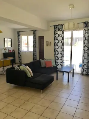 a living room with a couch and a table at Maison Diana - Tourism license 6990 in Protaras
