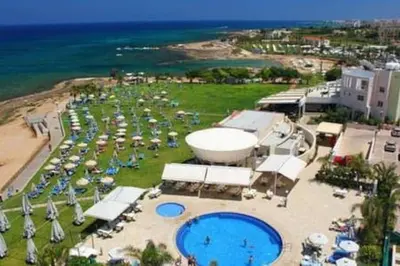 an aerial view of a resort with a pool and the ocean at Maison Diana - Tourism license 6990 in Protaras