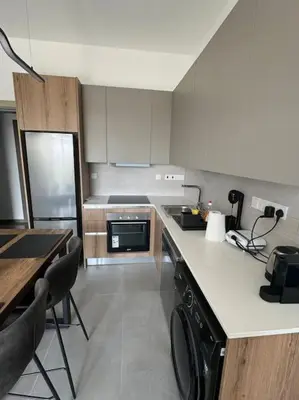 a kitchen with a stove and a dishwasher at Limassol Beautiful Apartment in Limassol