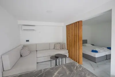 a living room with a couch and a bed at Gold Emerging Villas Ltd Apart 2 in Ayia Napa