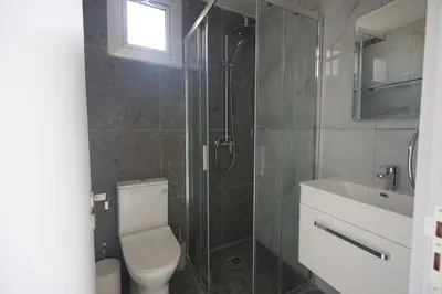 a bathroom with a toilet and a shower and a sink at Gold Emerging Villas Ltd Apart 2 in Ayia Napa
