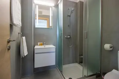 a bathroom with a shower and a sink at Beachside 1-bed with huge veranda in Protaras