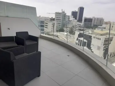 a room with a balcony with a view of a city at 360 Building - City View 2 Bedroom Residence in Nicosia