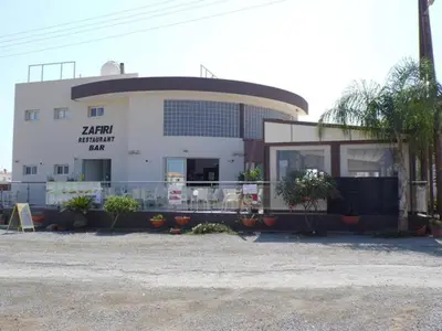 a large white building with a bird in front of it at Ayia Napa Marina Luxury Villas - Diamond in Ayia Napa