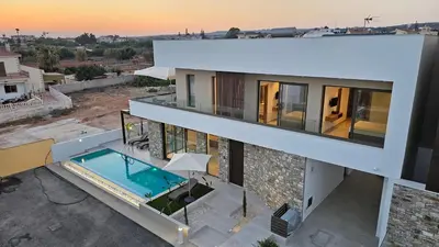 a house with a swimming pool on the roof at STAY Oasis Luxury Villas in Ayia Napa