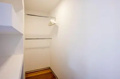 a white refrigerator in a room with a wall at The Loft Penthouse in the Heart of City Center in Nicosia