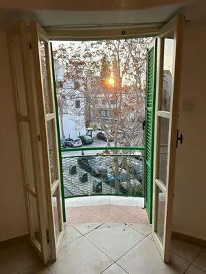 an open door with a view of a yard at city center accommodation in Nicosia