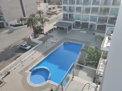 an overhead view of a large swimming pool on a building at Luxary Vacation by the Sea Protaras in Protaras