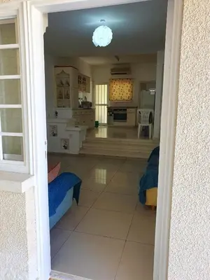 a view of a kitchen and a living room at The Little House in Voroklini