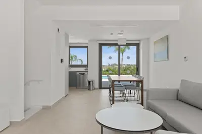 a living room with a couch and a table at Serenity Waves Villa 21 in Sophtadhes