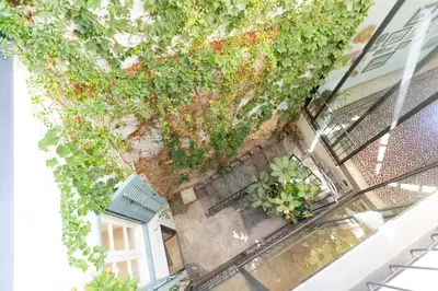 an overhead view of a building with plants at 1927 Heritage House - Indoor Garden , Old City in Nicosia