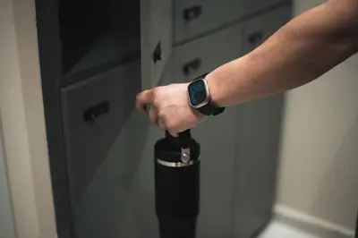 a person with a watch on their hand holding a bottle at Kition Urban Suite 2 in Larnaka