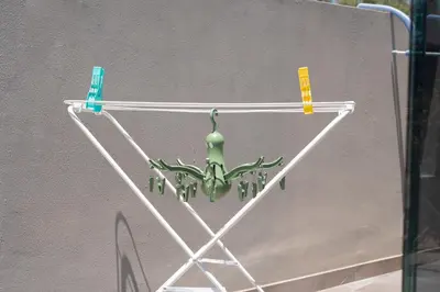 a green chandelier hanging on a wall at SuiteNapa22 in Ayia Napa