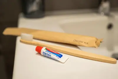 two wooden sticks and a toothbrush on a counter at SuiteNapa22 in Ayia Napa