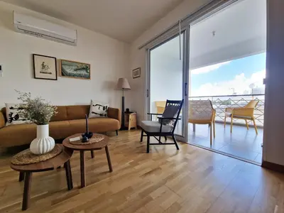 a living room with a couch and a table at STAY Space View Apartment in Nicosia