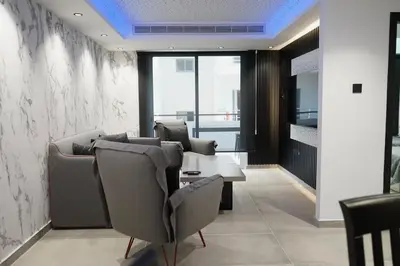 a waiting room with chairs and a table at Lazuli Urban Luxury -2 bedroom with Pool in Larnaka