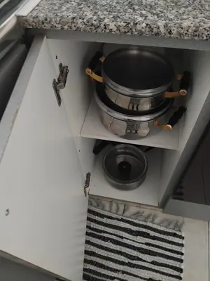 a cabinet with a pot on top of it at Irenes Apartment in Larnaka