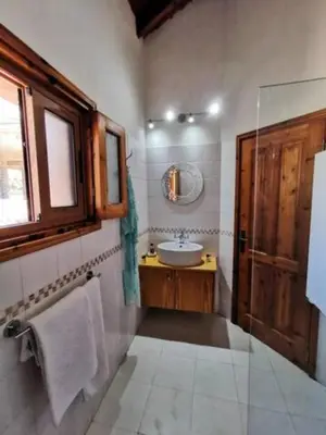a bathroom with a sink and a mirror at Wedding Unique Villa in Larnaka