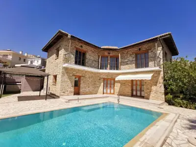 a house with a swimming pool in front of it at Wedding Unique Villa in Larnaka