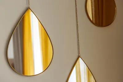 a mirror hanging on a wall with two mirrors at STAY Sunflower Delight Studio in Nicosia