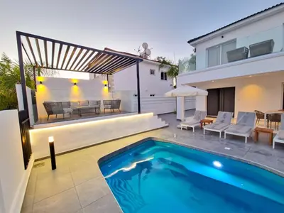 a swimming pool in the backyard of a house at Sunshine Villa Ayia Napa in Ayia Napa