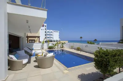 a view of a swimming pool on top of a building at Goodness Villa offers Magnificent Coastal Views in Protaras