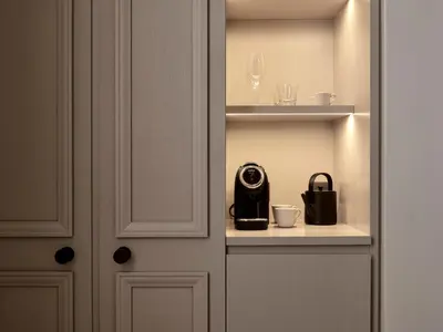 a room with a door with a coffee maker on a shelf at Amyth of Nicosia in Nicosia