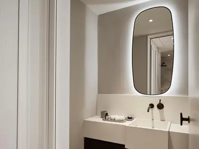 a bathroom with a white sink and a mirror at Amyth of Nicosia in Nicosia