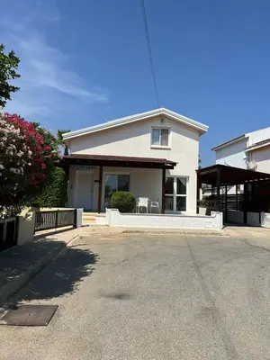 a white house with a porch and a driveway at Ayia Napa - Ayia Thekla Sea View Beach Villa in Ayia Napa