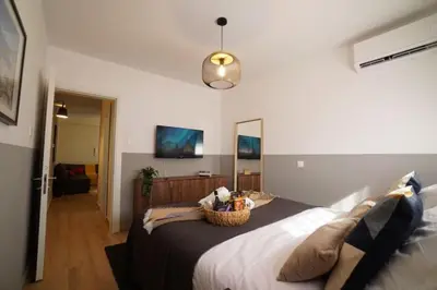 a bedroom with a large bed with a basket on it at Stylish Newly Renovated Flat, 250 Meters from the Beach, Central Location with Free Parking in Limassol