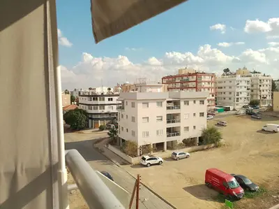 a view of a city with cars parked in a parking lot at alfaro57 in Nicosia