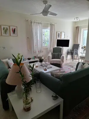 a living room with a couch and a table at Soleil Residence - Charming 2BR Holiday House with Garden at Protaras - Konnos Area in Protaras