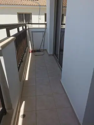 a balcony with a tile floor and a railing at Relax by the sea in Protaras