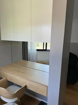 a dining room with a table and a chair at Larnaca Centre Villa in Larnaka