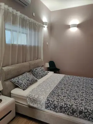 a bedroom with a bed and a window at Studio in the centre of Nicosia 2 in Nicosia