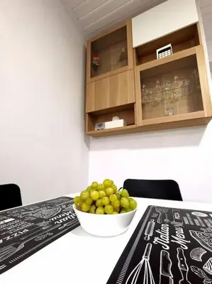 a bowl of green grapes sitting on a table at Freminore Eden Studio in Ayia Napa