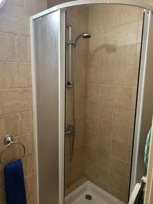 a shower with a glass door in a bathroom at Palm Villa 3 bedrooms - Sleeps 6 in Ayia Napa