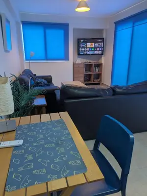 a living room with a couch and a table at Kiti 2 bedroom Penthouse in Kiti