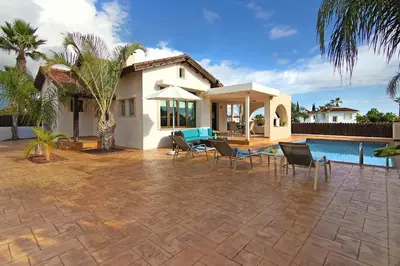a house with a patio and a swimming pool at Villa Merry in Ayia Napa