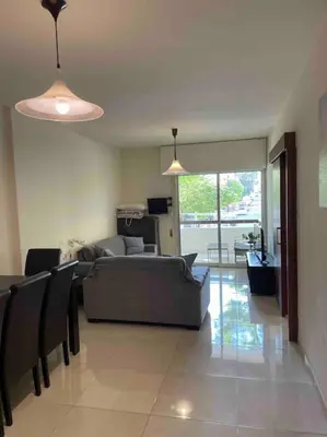 a living room with a couch and a table at Cozy comfortable 2-bedroom apartment in Limassol