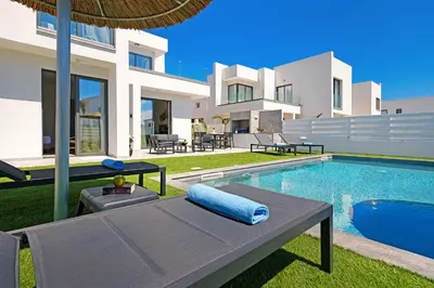 a villa with a swimming pool and a house at Villa Flora - 3Bed all En-suite with Private Pool in Paralimni