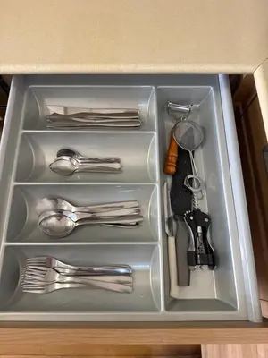 a drawer with forks and spoons and utensils at Ithaki Phinikoudes Apartment No. 202 in Larnaka