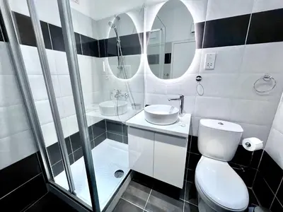 a bathroom with a toilet and a sink and a mirror at STAY Napa Velvet Apartment in Ayia Napa