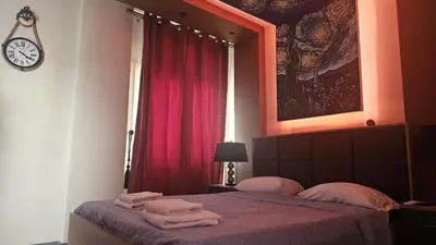 a bedroom with a bed with towels on it at STAY Van Gogh Apartment in Larnaka