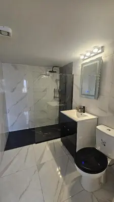 a bathroom with a toilet and a sink and a shower at STAY Van Gogh Apartment in Larnaka